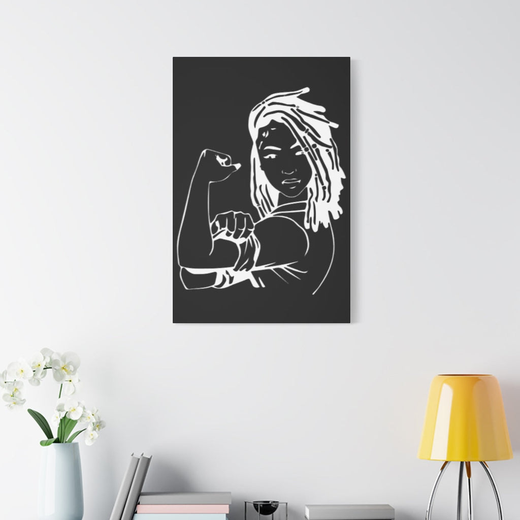 Canvas print of a black and white illustration of a woman with a raised fist on a wall in a modern room.