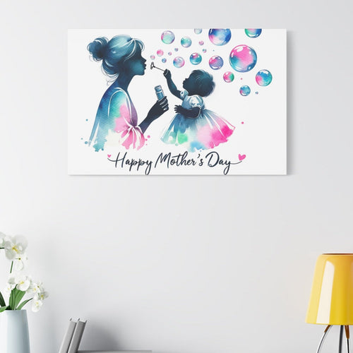 Canvas print with a colorful illustration of a mother and child blowing bubbles, featuring 'Happy Mother's Day' text, on a wall above a shelf.